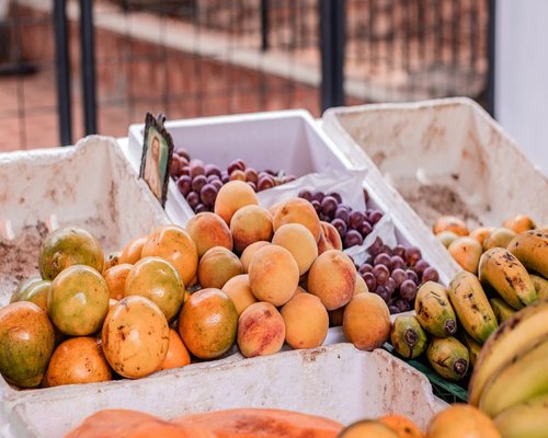 Vibrant display of tropical fruits in a traditional Colombian market stall